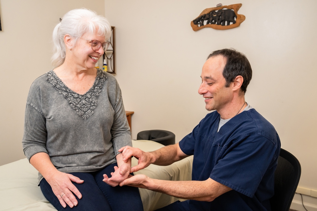 Jason with a patient at Shen Dao Clinic