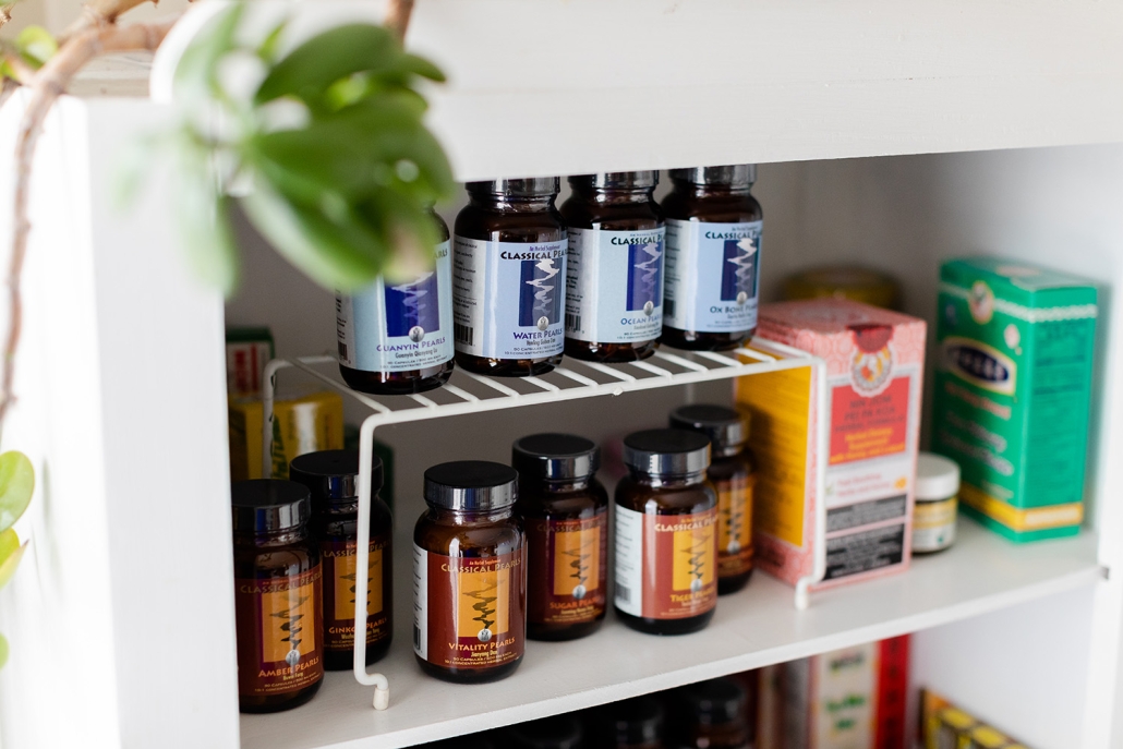 shelf of medications used at Shen Dao